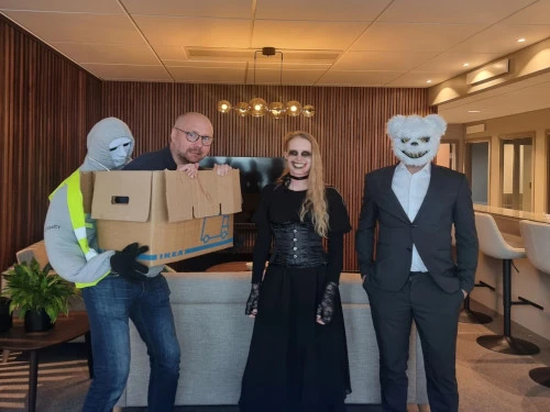 Employees dressed up for halloween.